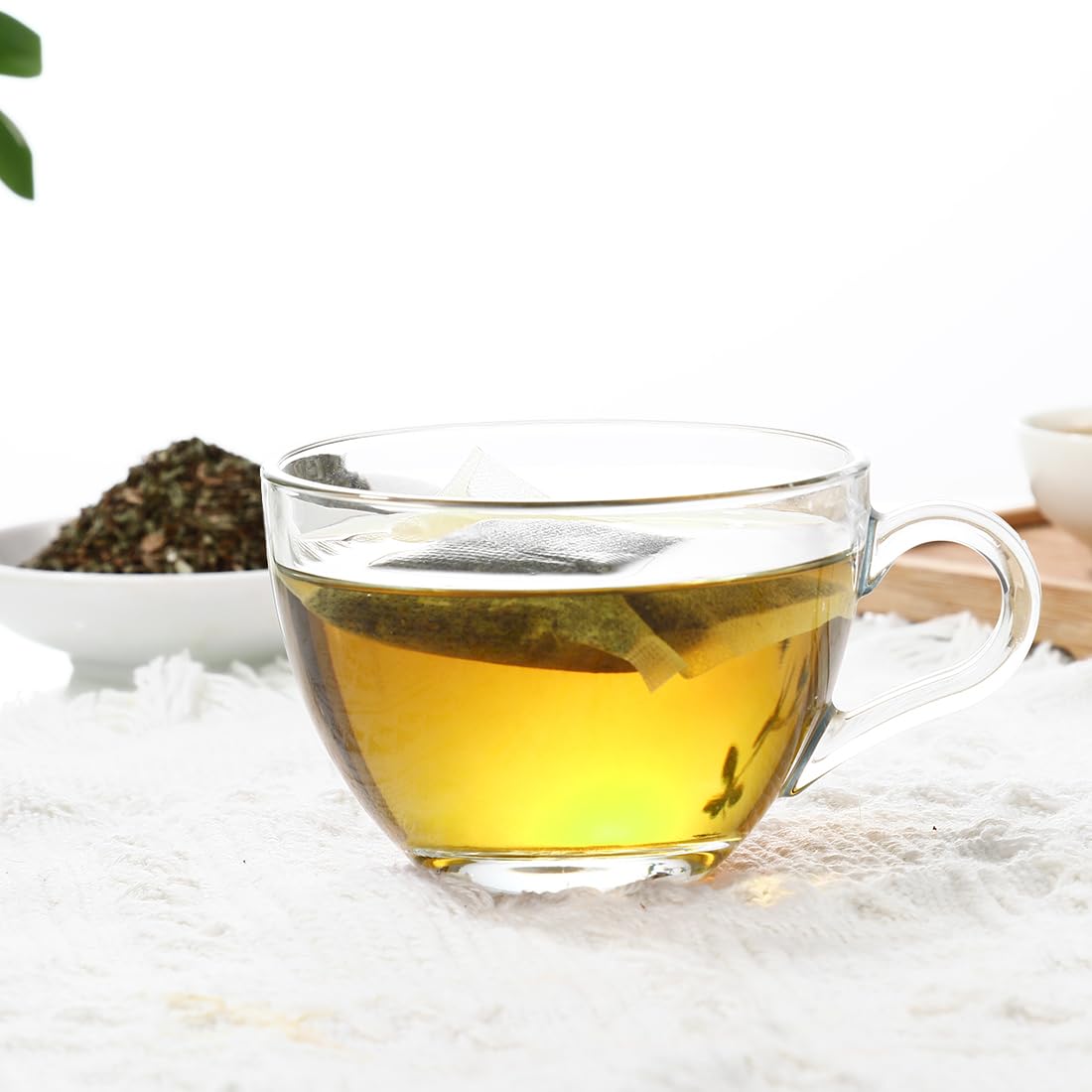 ULTHMOK spearmint tea bag closeup shows vibrant leaves and aroma