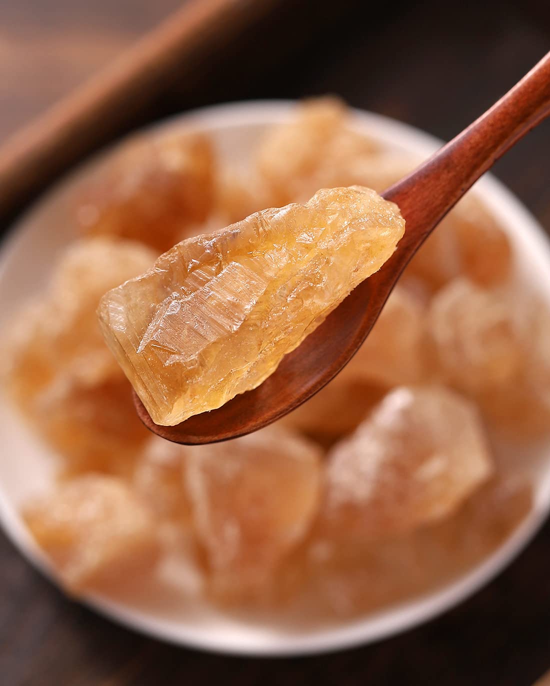 ULTHMOK translucent amber sugar crystals dissolving in hot tea.
