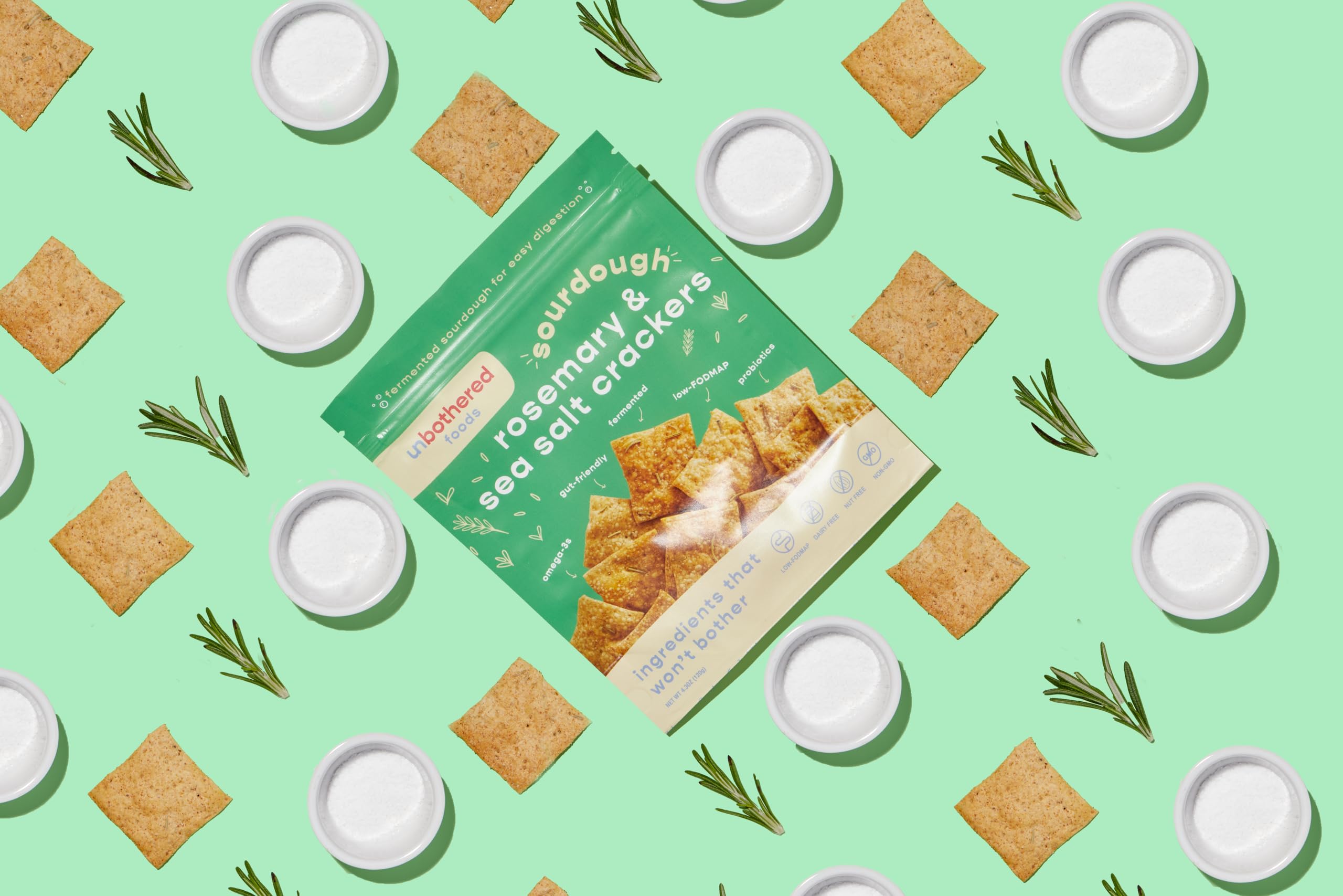 Olive oil-dipped Unbothered Foods sourdough crackers for Mediterranean bite.