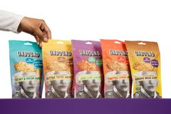 Unbound Snacks walnut flavors display on tray, flavorful protein boost for trails