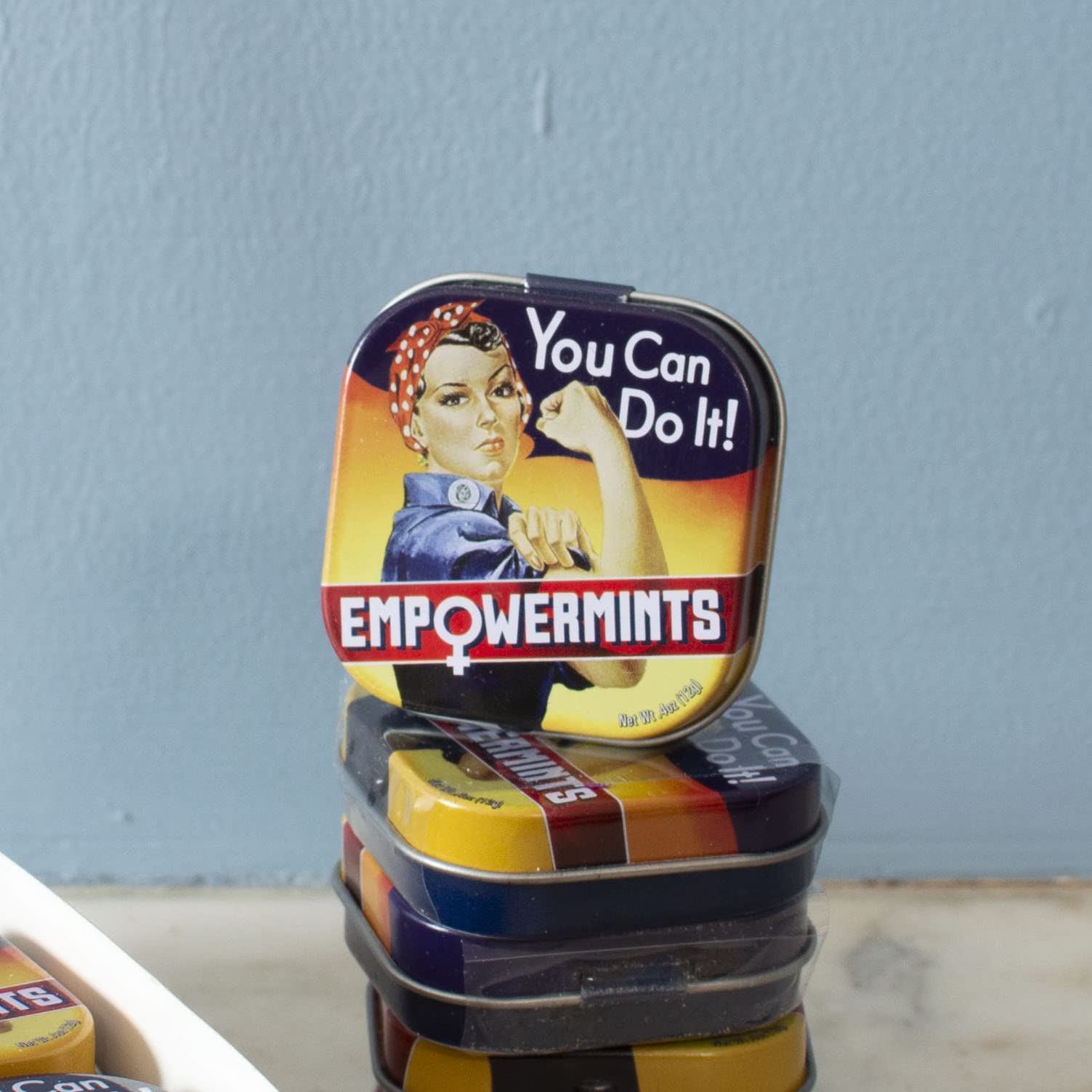 Pocket-sized EmpowerMints tin ready to tuck into a bag or pocket.