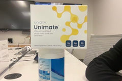 Unicity Unimate Lemon Ginger stick pack back view with usage notes.