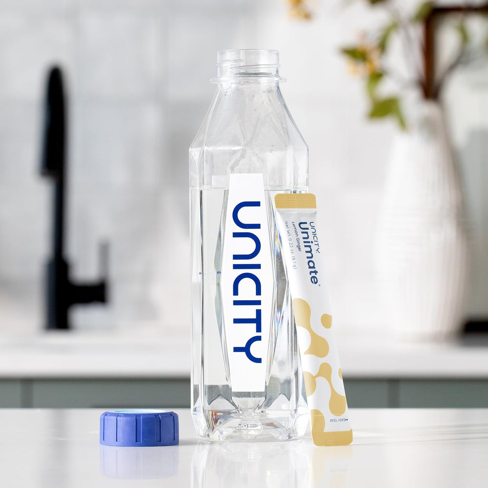 Unicity Unimate Lemon Ginger stick pack open-contents reveals individual packets.