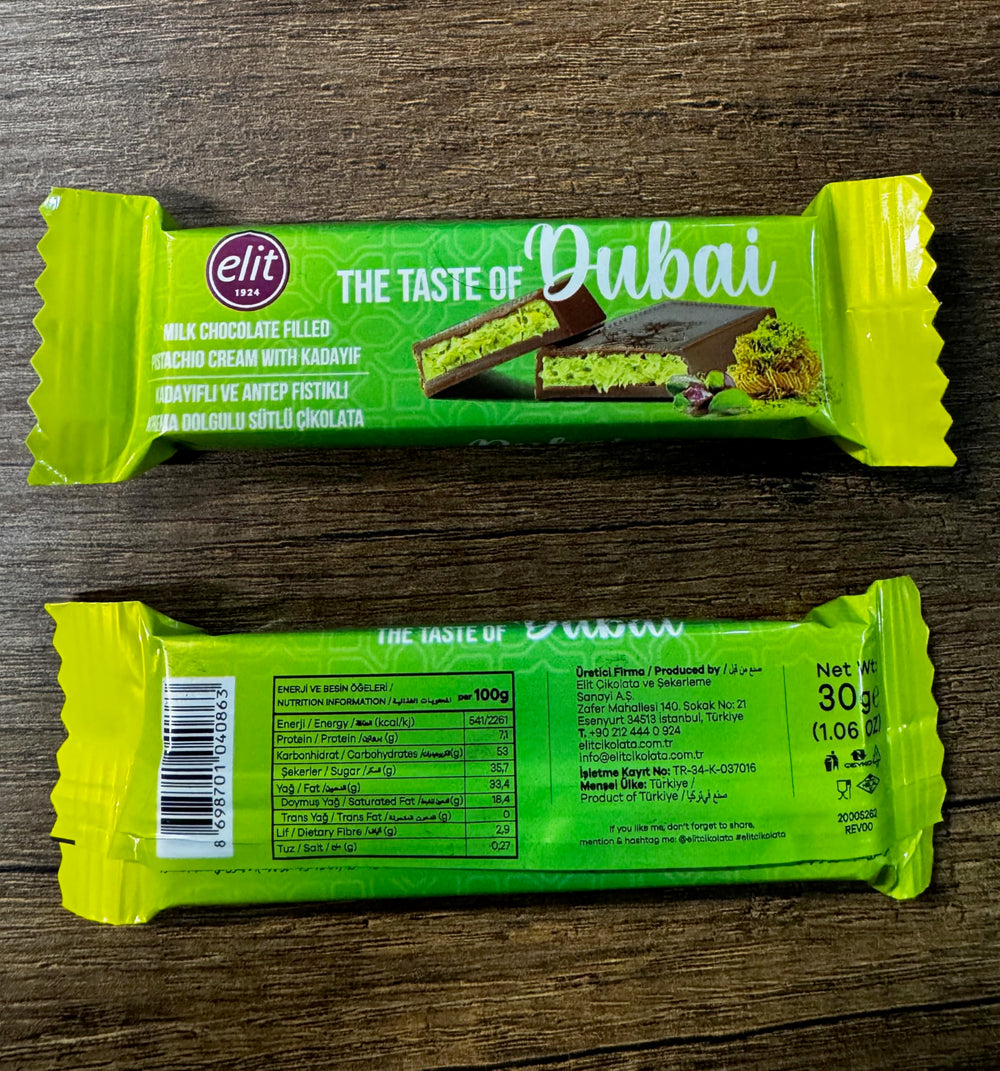 UNIQBITE Mini Dubai Pistachio Bar bar close-up reveals silky milk chocolate for personal indulgence.
