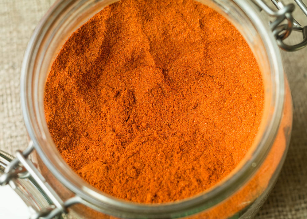 Unpretentious ground cayenne pepper dusting on lime for vibrant flavor