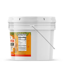 Unpretentious Pumpkin Powder tub closeup highlighting vibrant orange powder for smoothies and desserts.