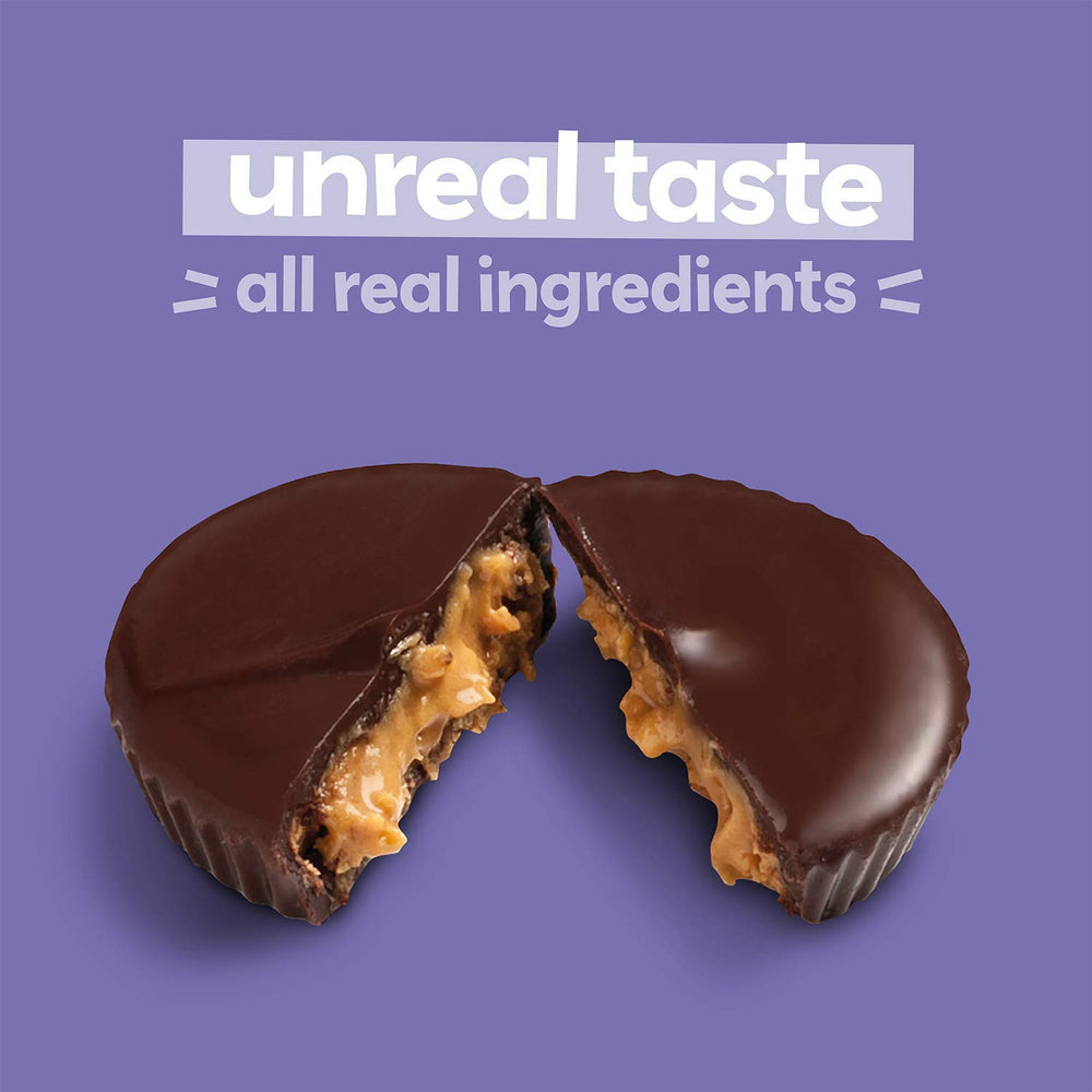 UNREAL almond butter cup on a surface ideal for on-the-go.