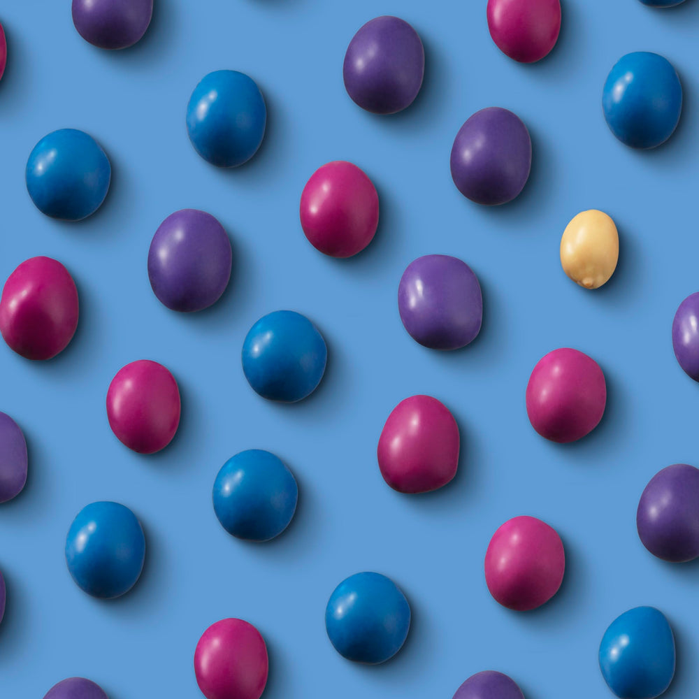 UNREAL Dark Chocolate Peanut Gems lifestyle shot for on-the-go treats.