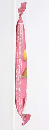 UNREAL Milk Chocolate Gems spotlight emphasizes glossy finish and premium appeal.