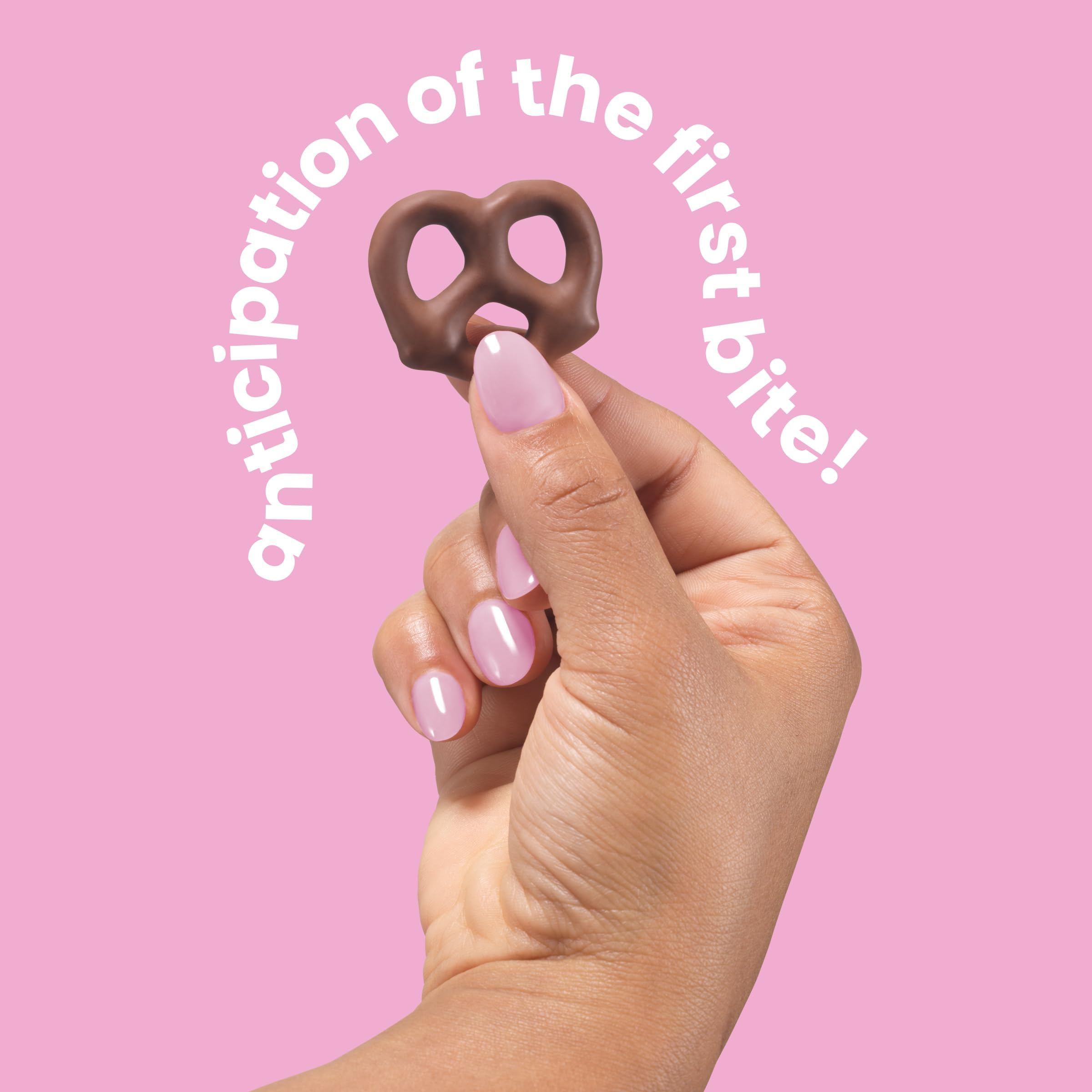 UNREAL Milk Chocolate Pretzels in hand for convenient on-the-go snacking