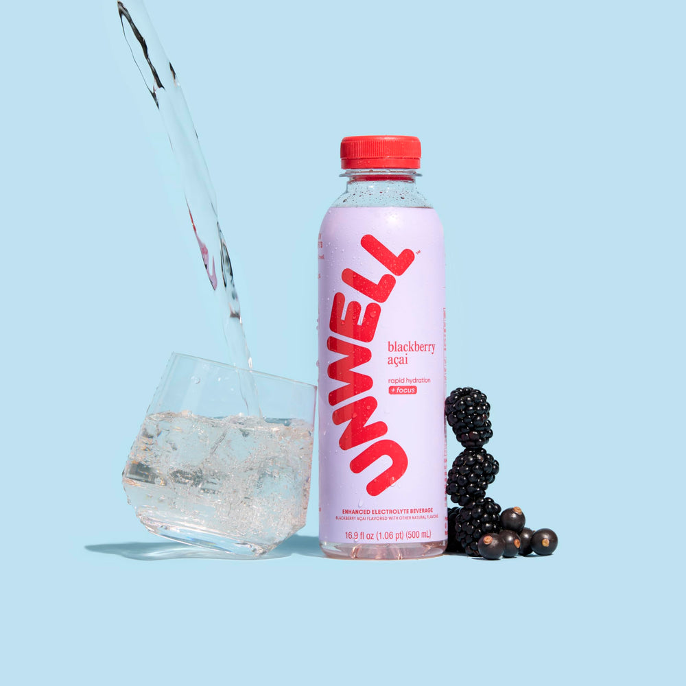Unwell Hydration bottle pouring with natural flavor profile.