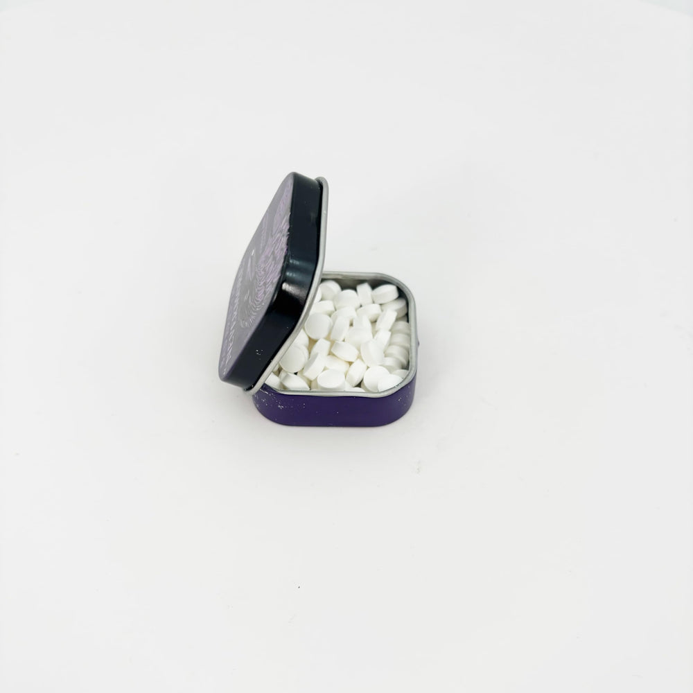Nevermore Mints travel-ready tin fits in bags for on-the-go freshness.