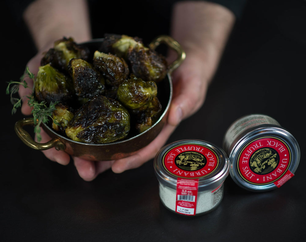 Urbani truffle salt on pasta, enhancing aroma and depth.