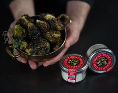Urbani truffle salt on pasta, enhancing aroma and depth.
