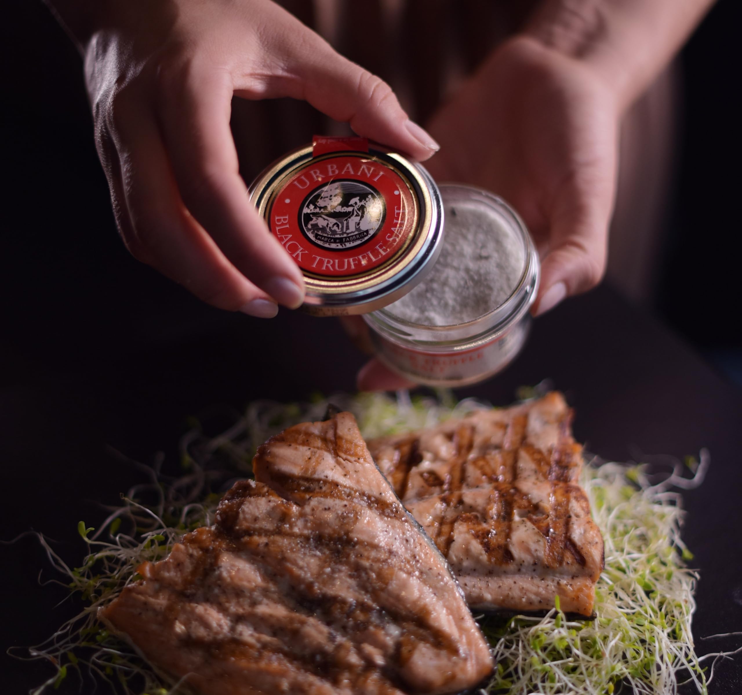 Urbani Truffles white truffle salt jar close-up for aromatic finishing touch.