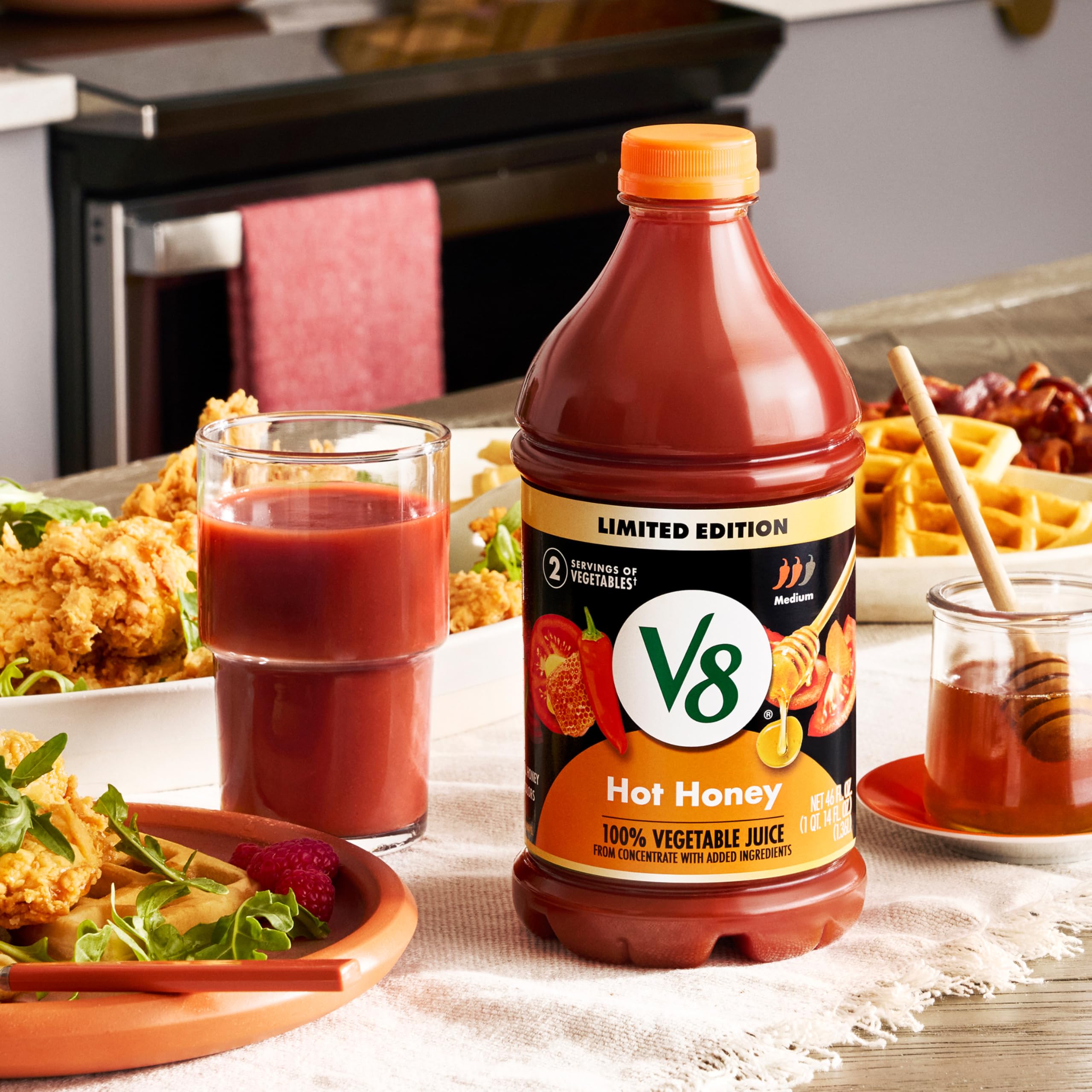 V8 Hot Honey ingredients visual shows vegetables blended for flavor.