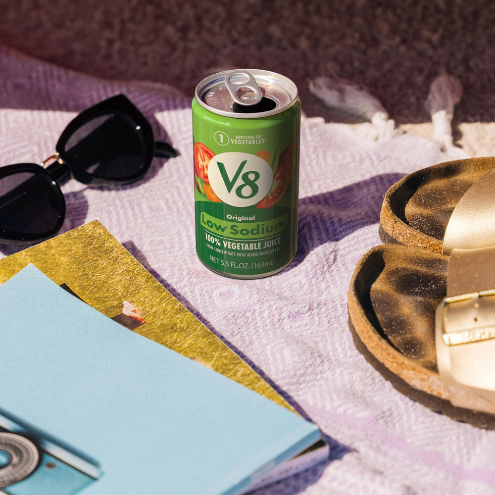 V8 pouring into glass for quick veggie boost.