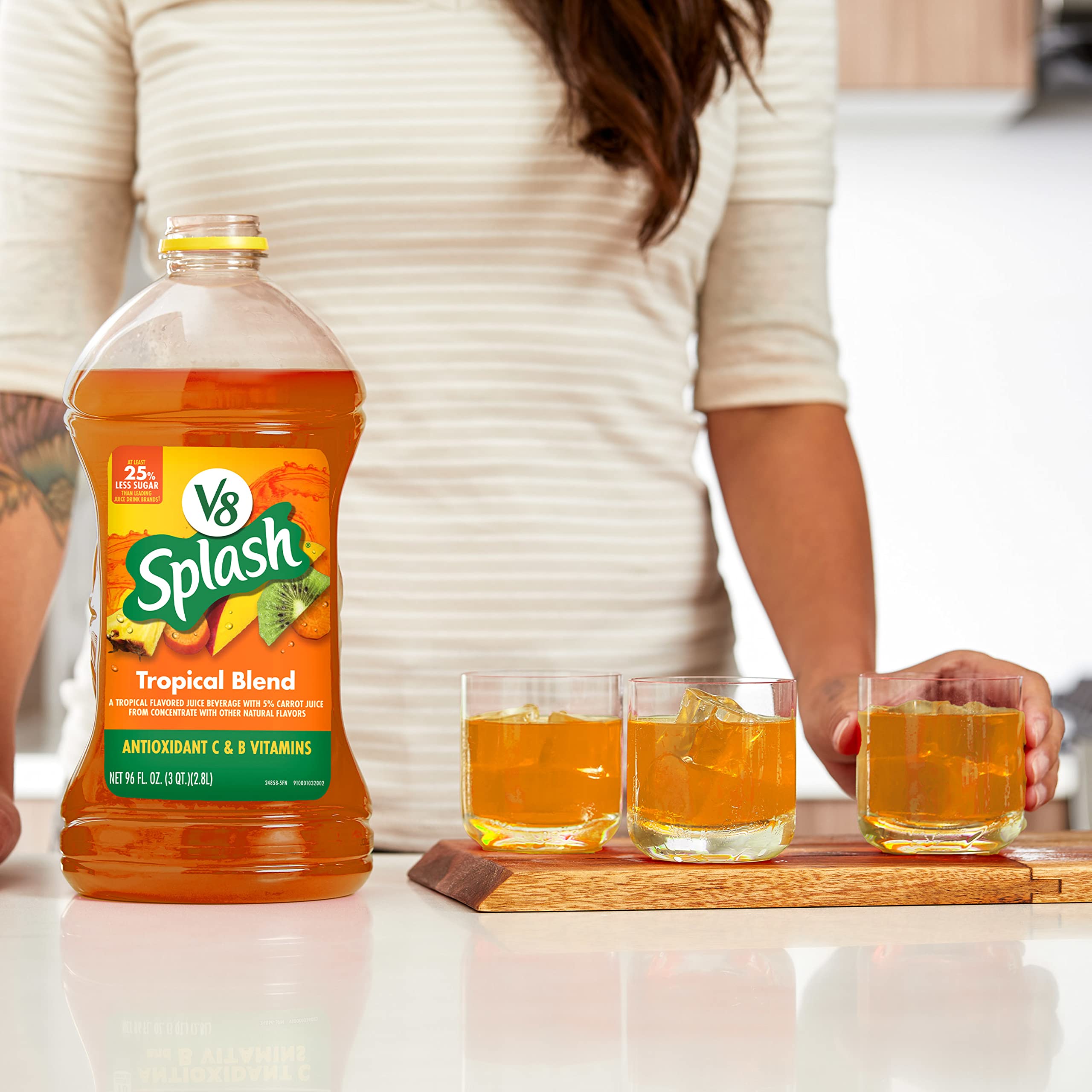 V8 Splash Tropical Blend bottle on kitchen table for family drink time.
