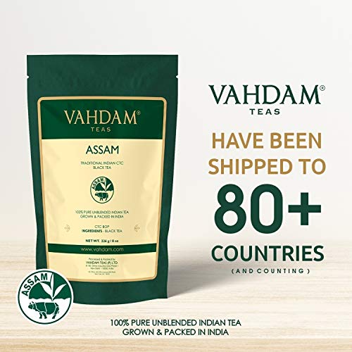 VAHDAM Assam tea being poured into a cup with rich amber color.