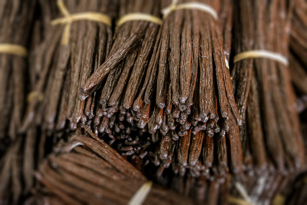 Extract being poured into batter from Vanilla Bean Kings bottle.