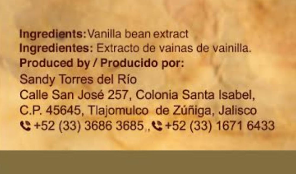 Vanilla Totonacs pour spout close-up demonstrates controlled flavor application.