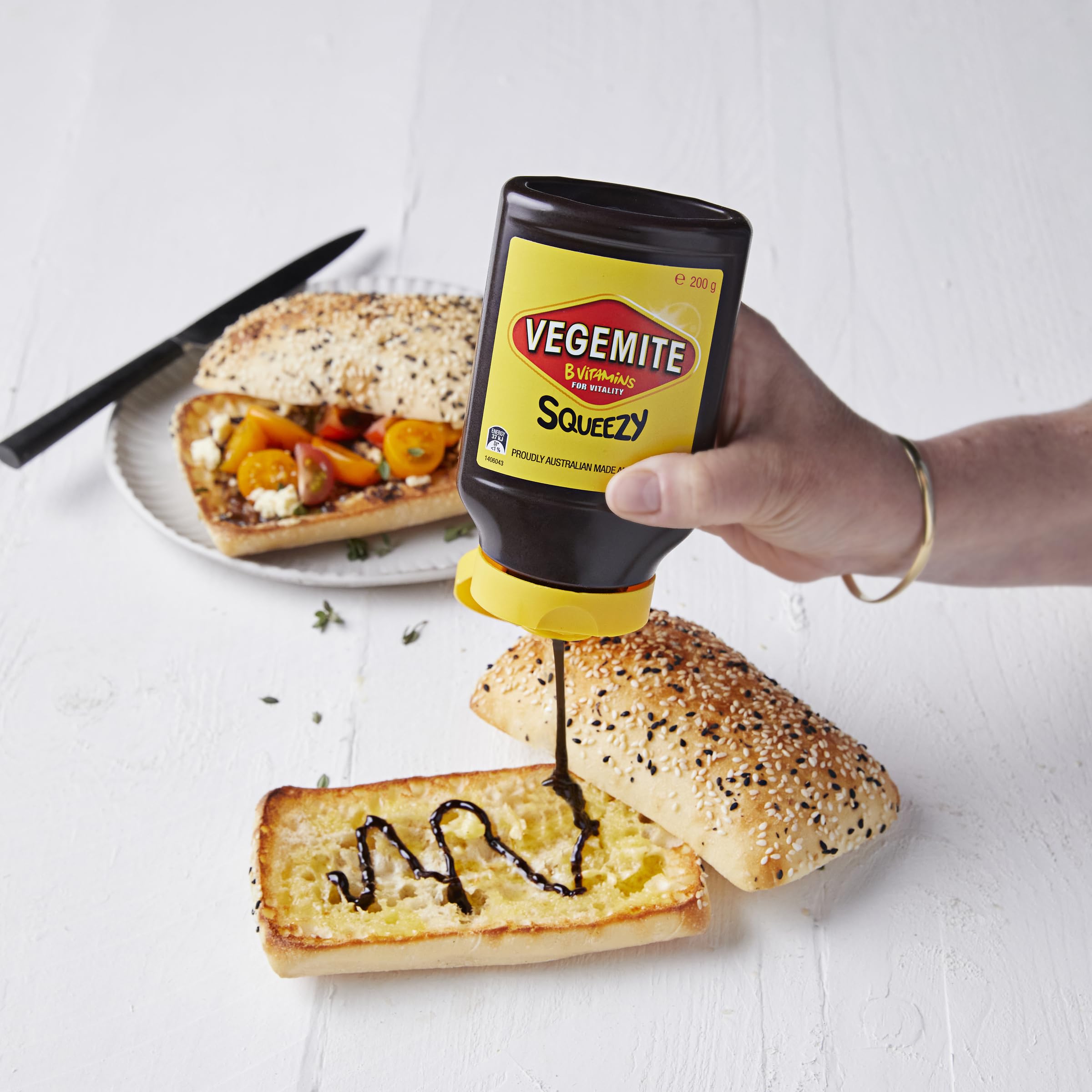 Australian-made Vegemite Squeezy in pantry with durable packaging.