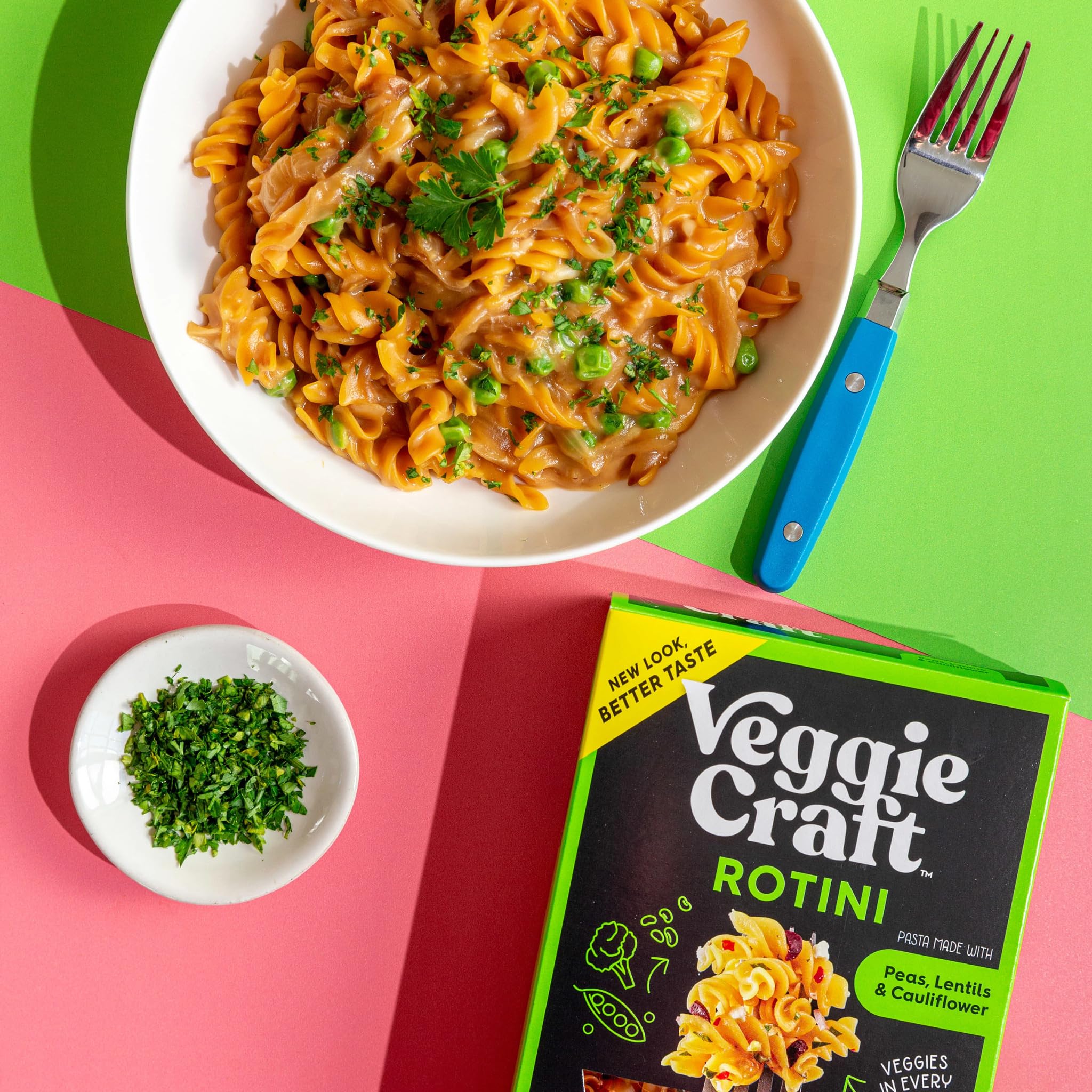 Kitchen counter with ingredients and prepared Veggiecraft Farms Rotini pasta.