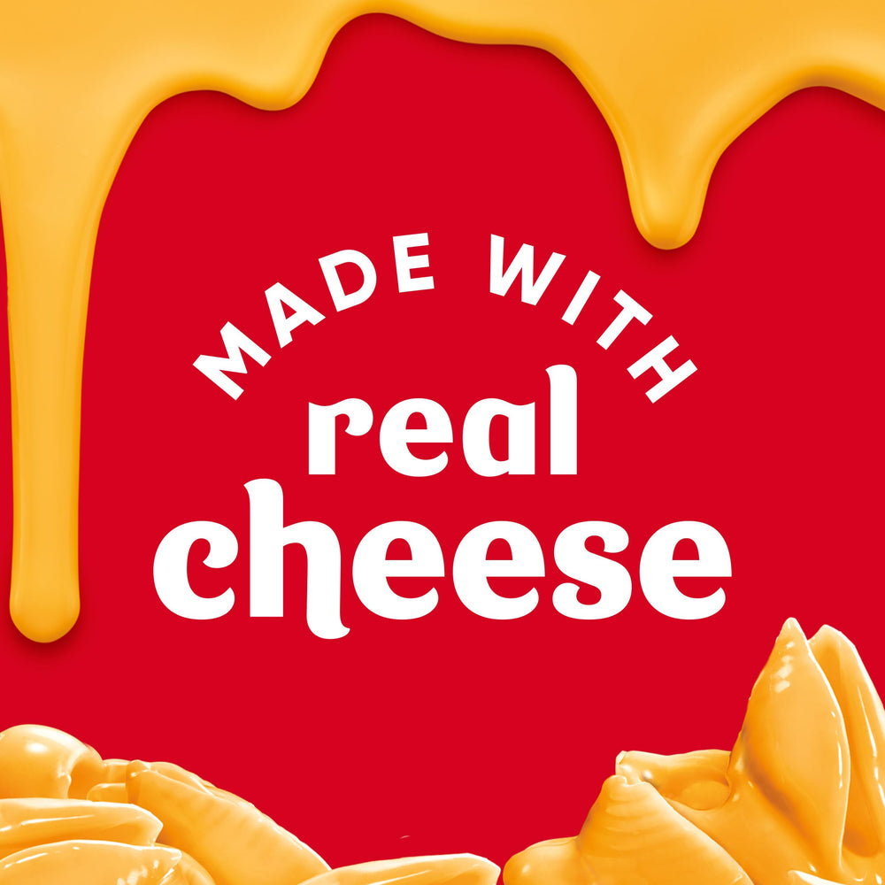 Velveeta box open with spoon ready to serve.