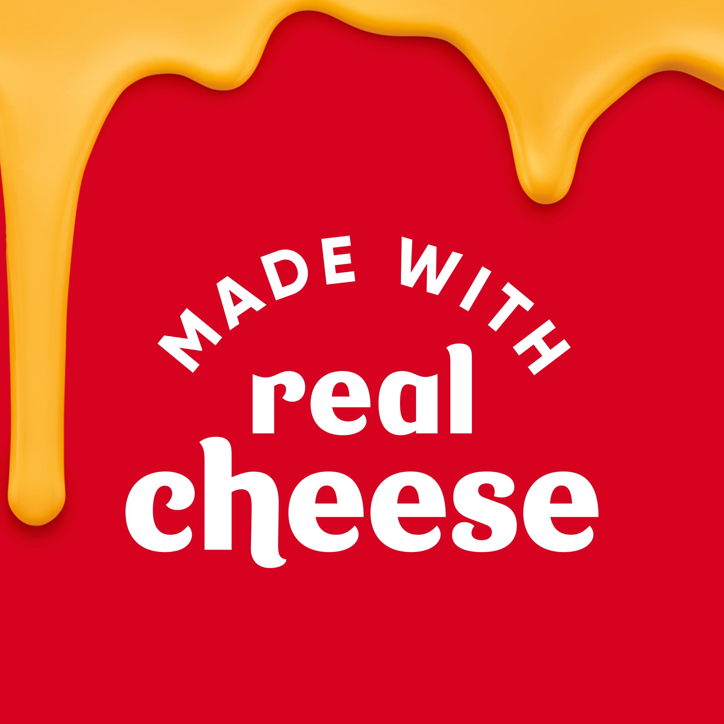 Velveeta Cheesy Bowls cheese sauce being stirred into pasta and beef