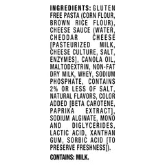 Velveeta Gluten Free Shells and Cheese cheese sauce packet beside pasta for easy preparation.