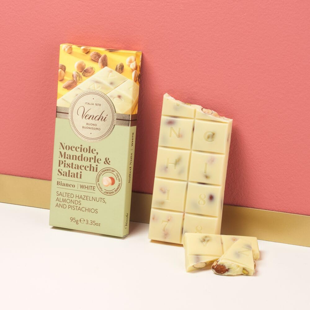 Venchi ingredients close-up: pistachios, hazelnuts, and almonds in premium chocolate.
