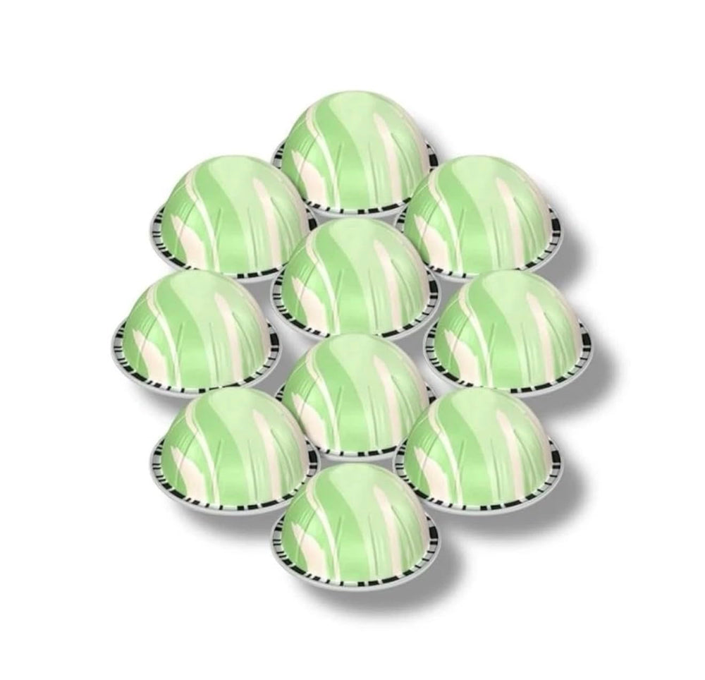 Glass showing Vertuo pistachio-vanilla pods brewing over ice for a refreshing drink.
