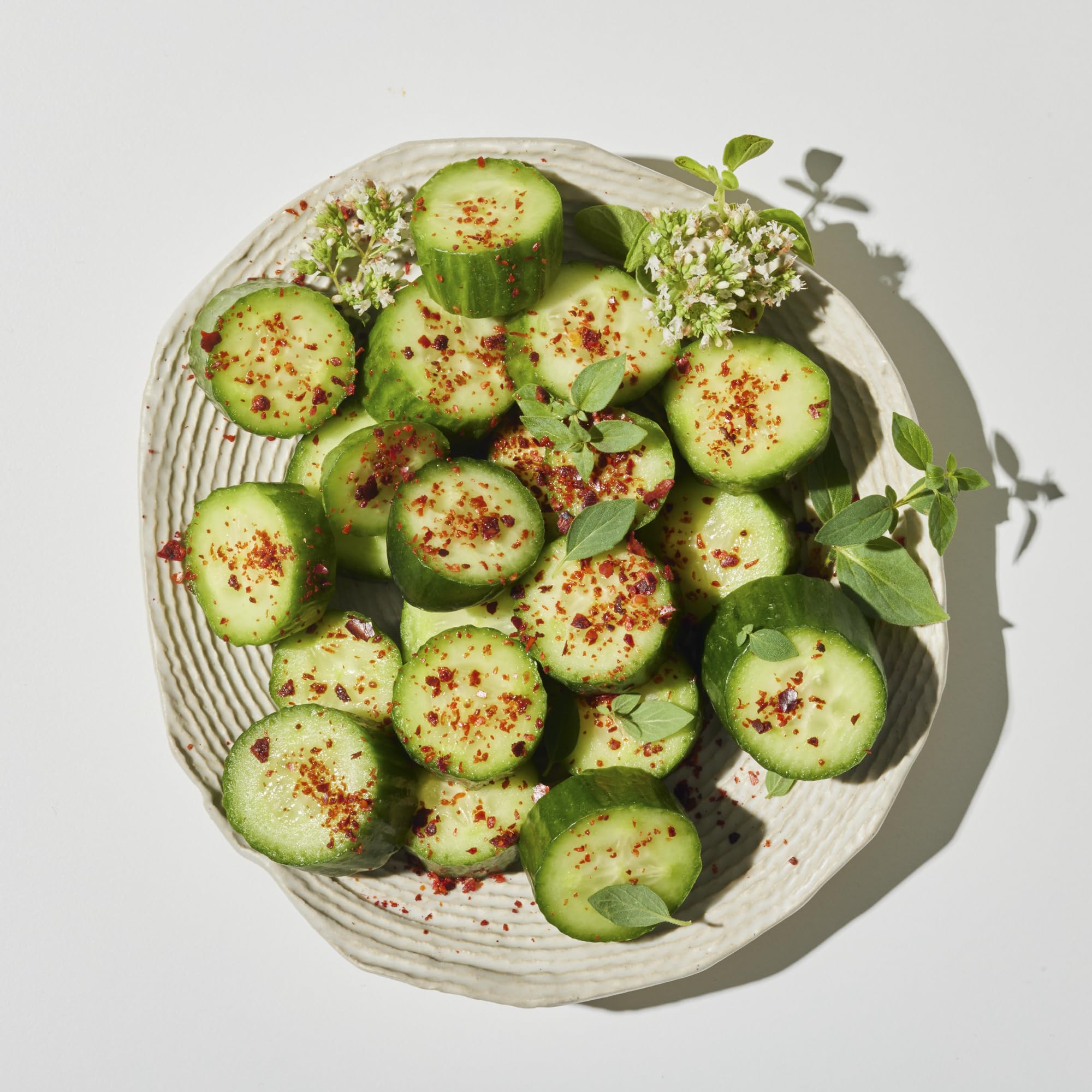 Villa Jerada Aleppo Pepper flakes in a bowl for vibrant flavor accent.