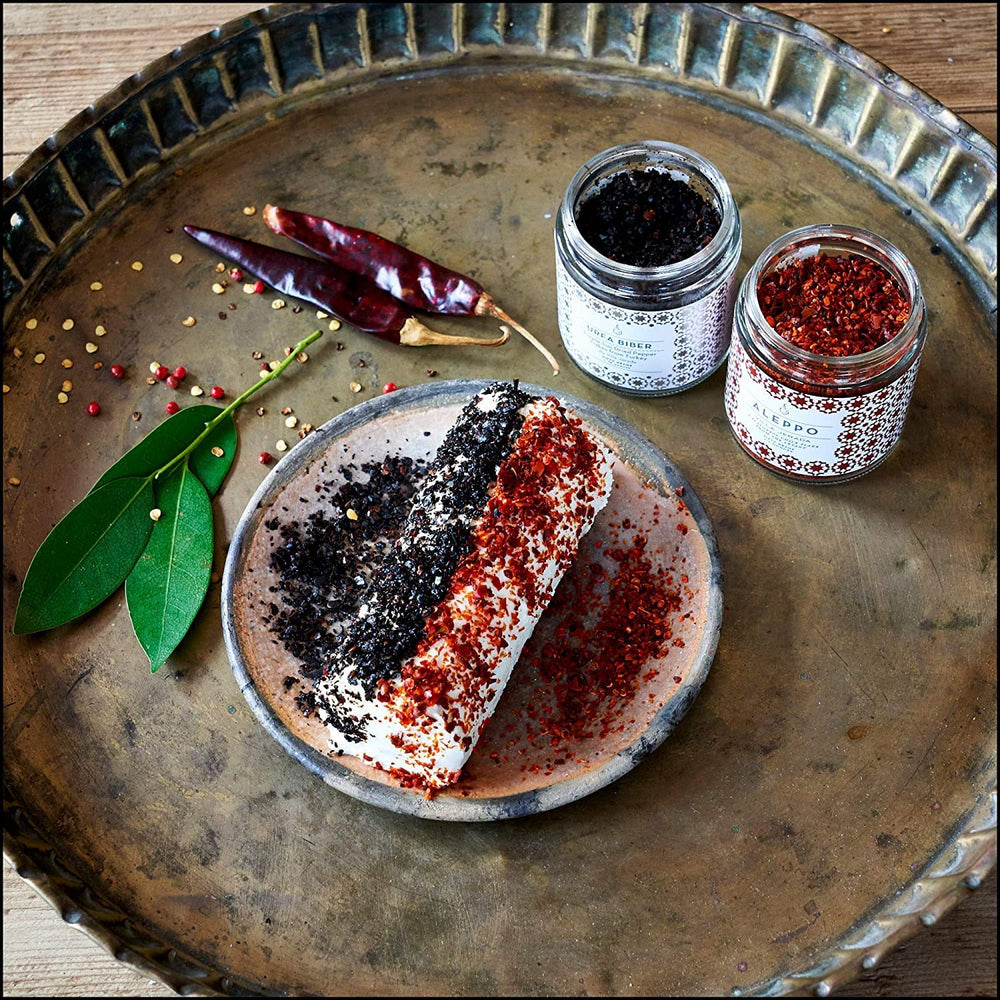 Villa Jerada Aleppo Pepper spice rub on meat for grilling.