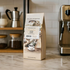 A steaming cup from Village Favorites highlighting chocolate and nuts aroma