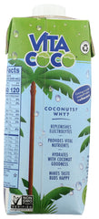 Pouring Vita Coco Pineapple Coconut Water into a glass for a tropical treat
