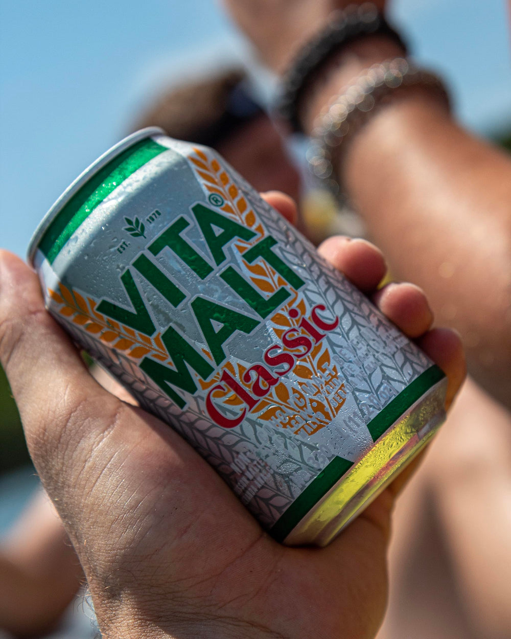 Vitamalt Classic ingredients closeup, malt, hops, and caramel flavoring
