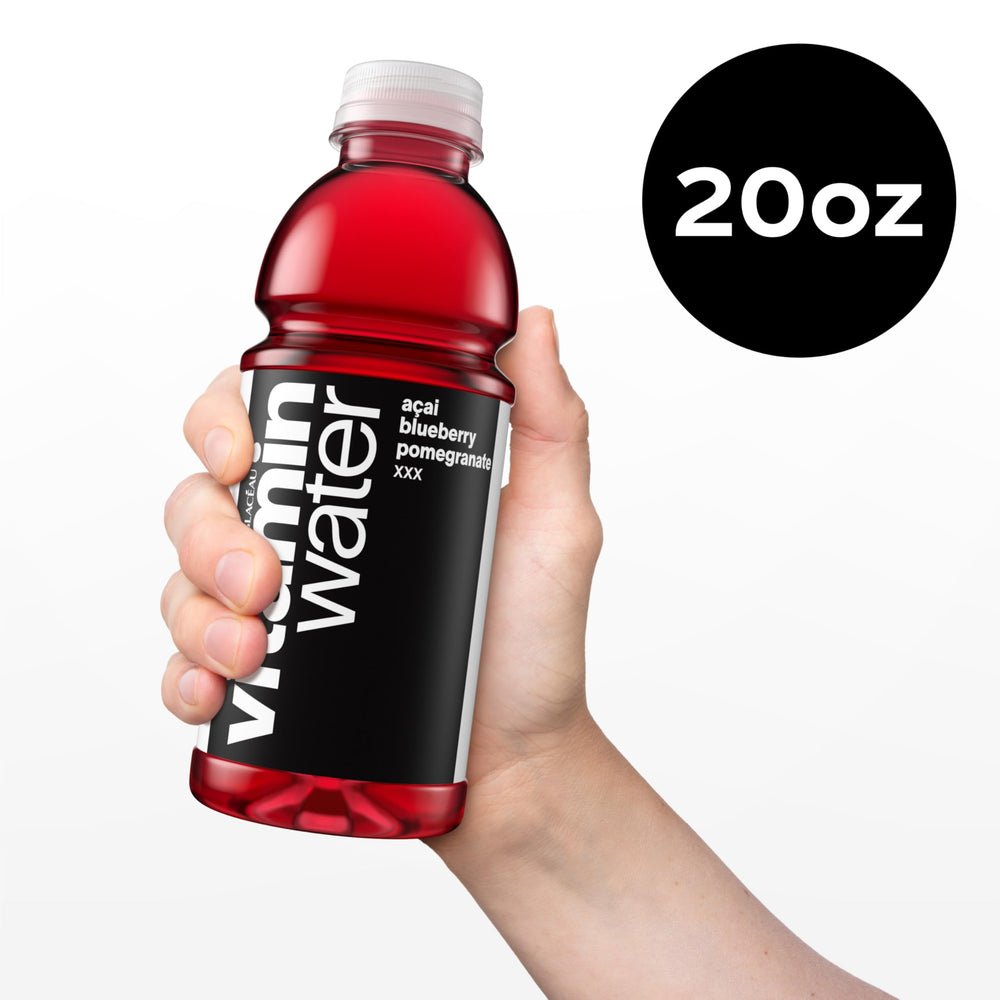 Chilled glass of Vitaminwater XXX Acai Blueberry Pomegranate over ice.