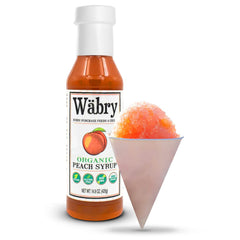 Wäbry Peach Syrup stirred into tea for a fragrant peach twist.