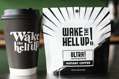 Wake The Hell Up! steaming cup showcases bold flavor for a strong morning start.