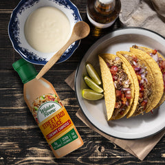 Creamy chipotle sauce drizzled over burrito for flavor.