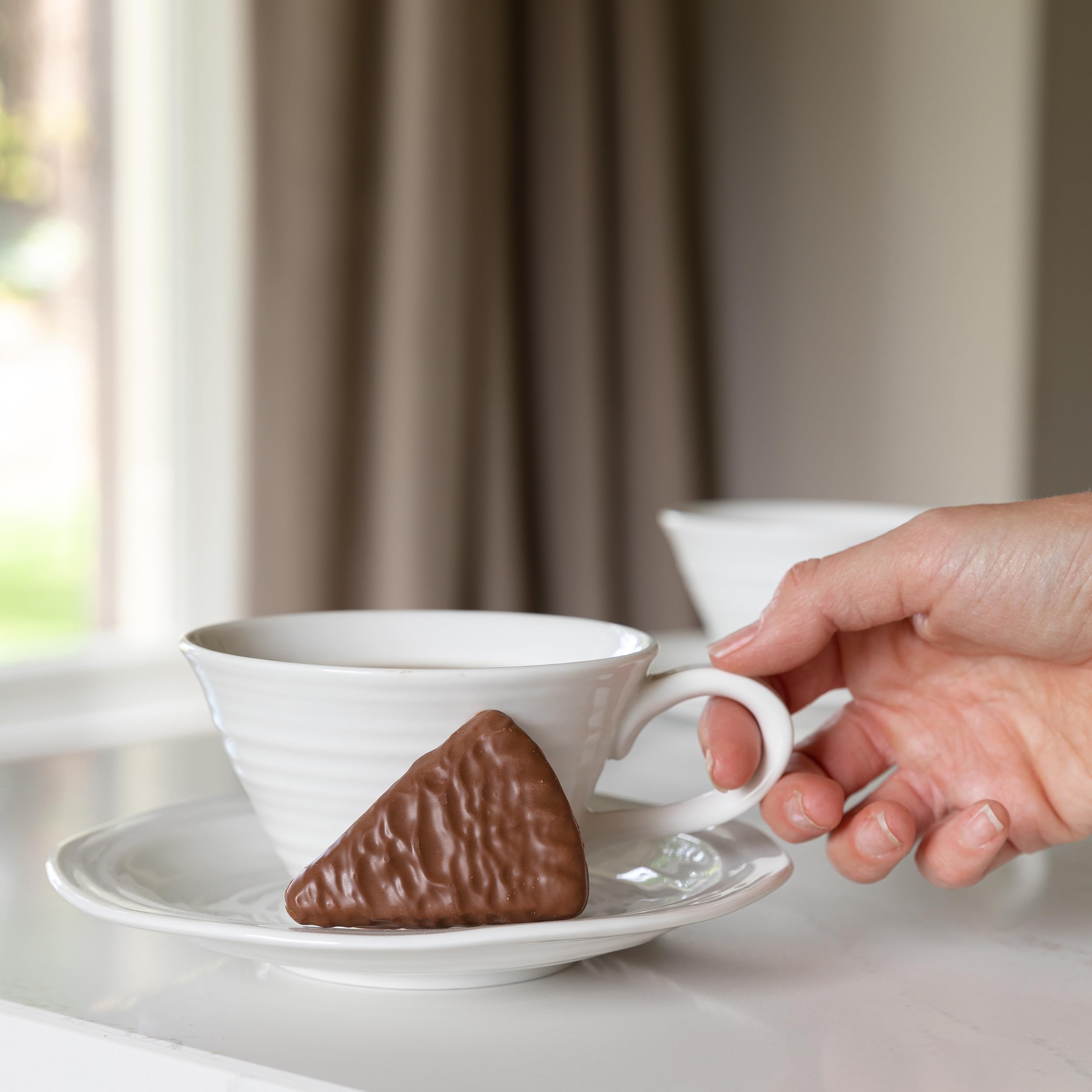 Walkers gift-ready tin of chocolate shortbread for festive gatherings.