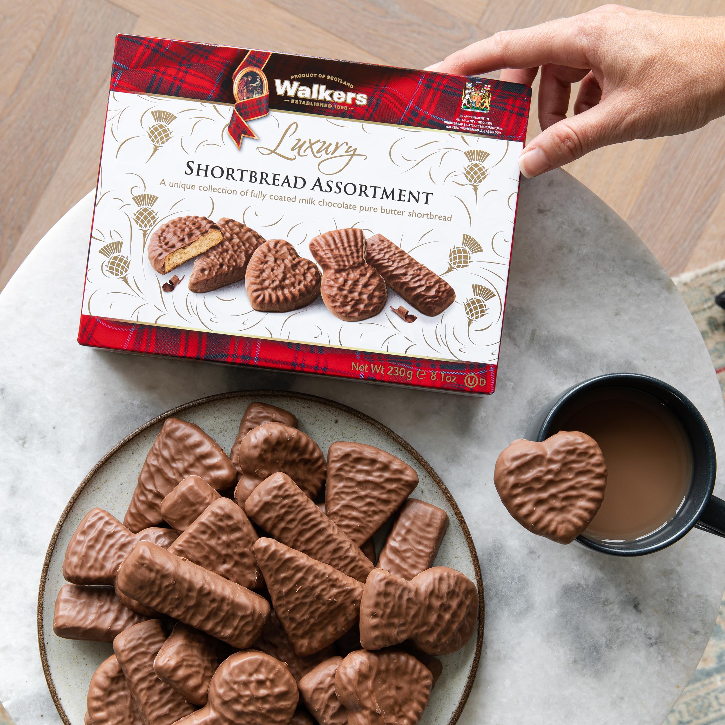 Walkers chocolate-coated shortbread hearts and triangles, a festive gift-ready assortment.