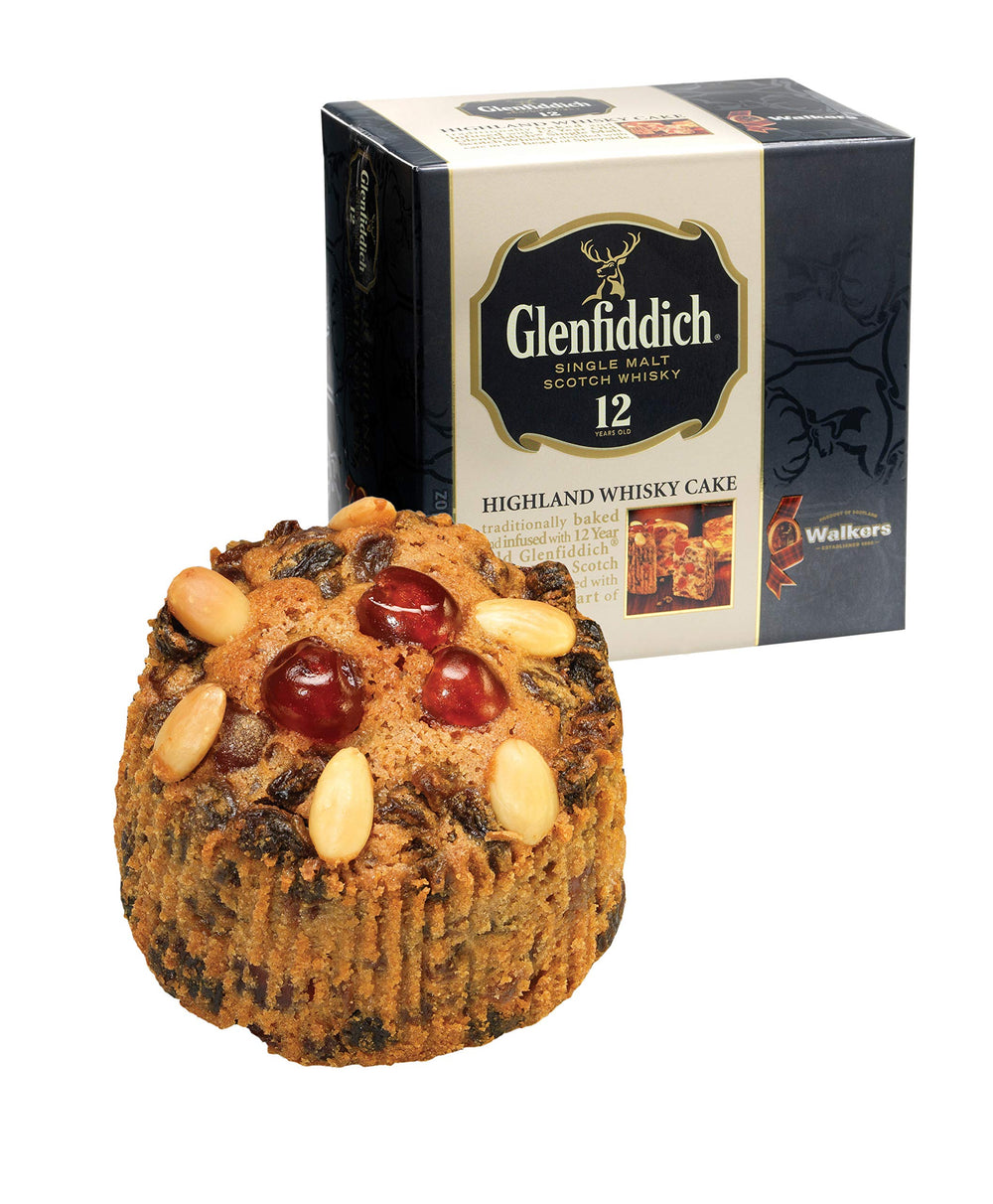 Walkers Highland Whisky Cake being cut for festive sharing.