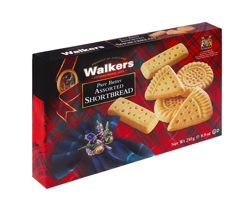 Walker's Shortbread triangles cookies on a plate, ideal for gifting.