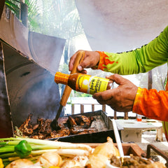 Walkerswood Jerk BBQ marinade bottle ready to glaze savory roasts