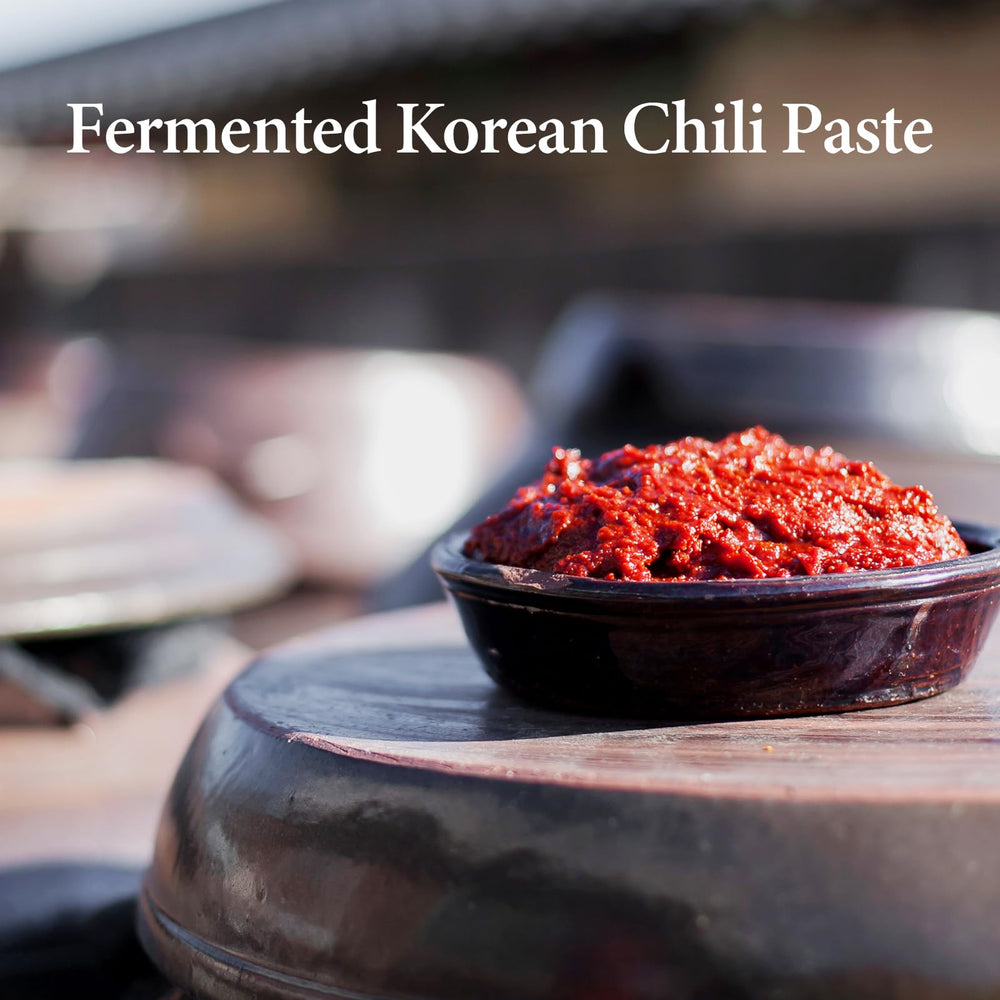 Wang gochujang spooned into a bowl for stir-fries and bowls.