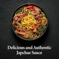 Wang Premium Japchae Sauce coats glass noodles and vegetables for stir-fry.