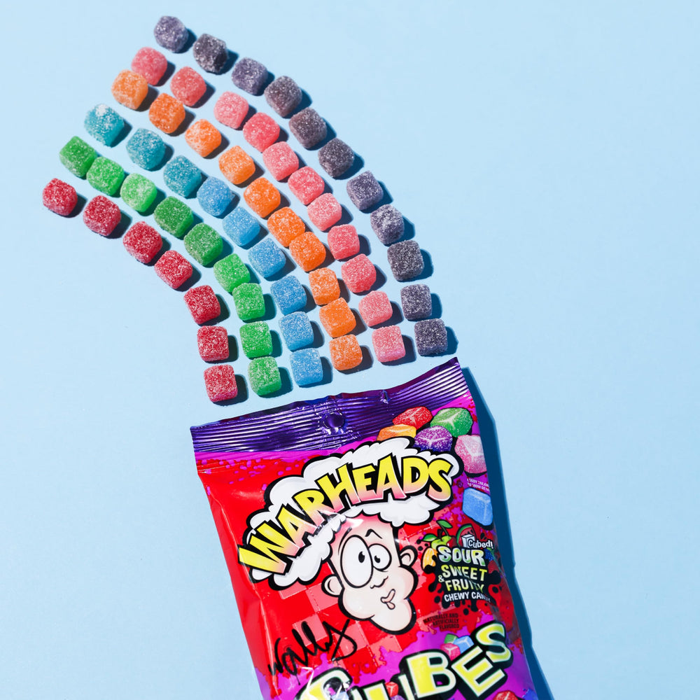 Warheads Cubes strawberry flavor close-up, fruity tang in bite-sized cubes.