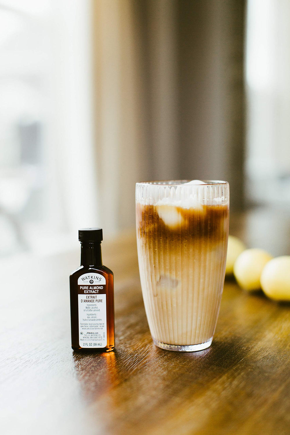 Watkins Almond Extract in a bright kitchen scene showing versatility in baking.